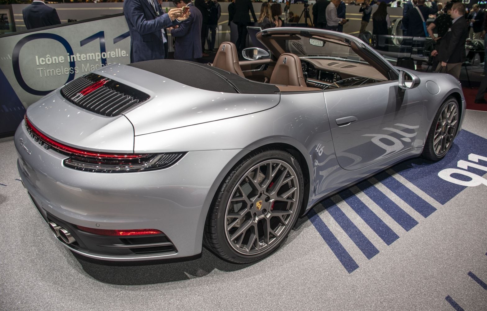 Rear and open interior of a modern cabriolet convertible sports coupe with distinctive design.