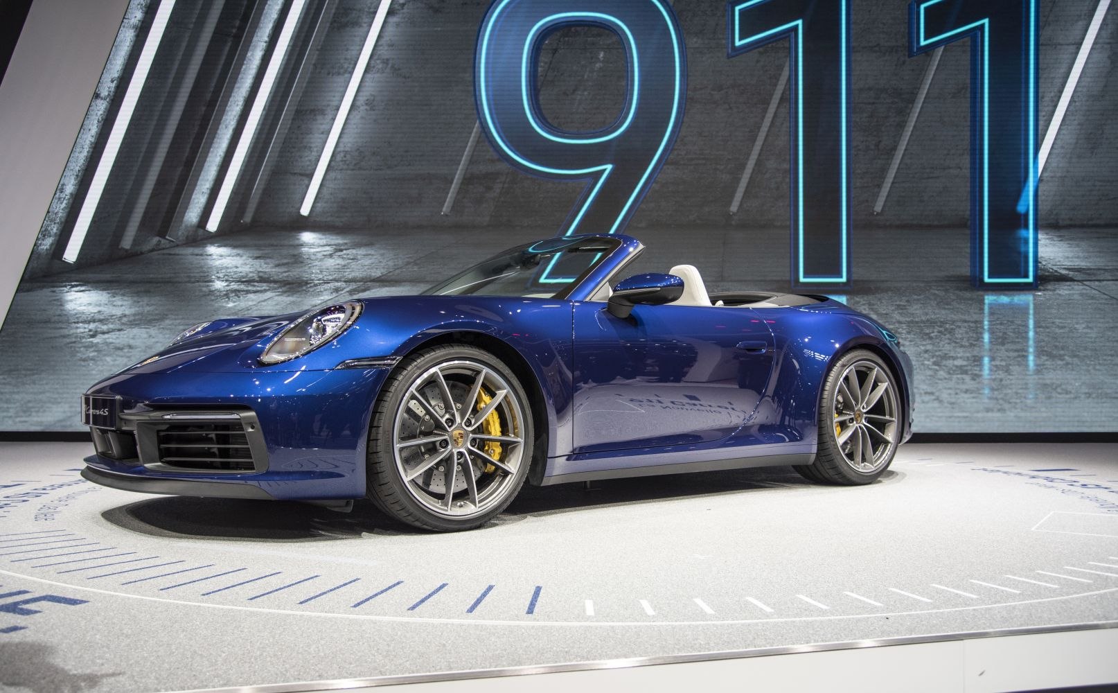 Blue convertible with alloy wheels and yellow brake calipers