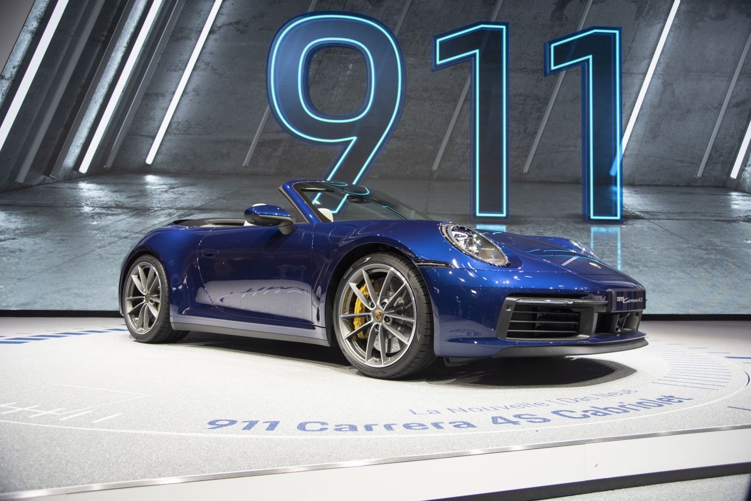Blue convertible sports car front profile with alloy wheels