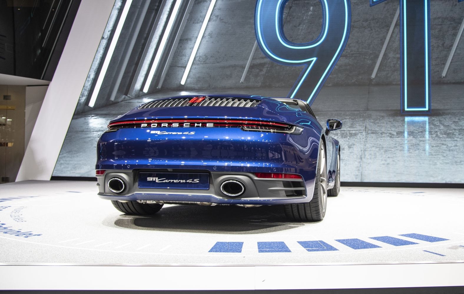 Rear view with dual exhaust tips and modern taillights.