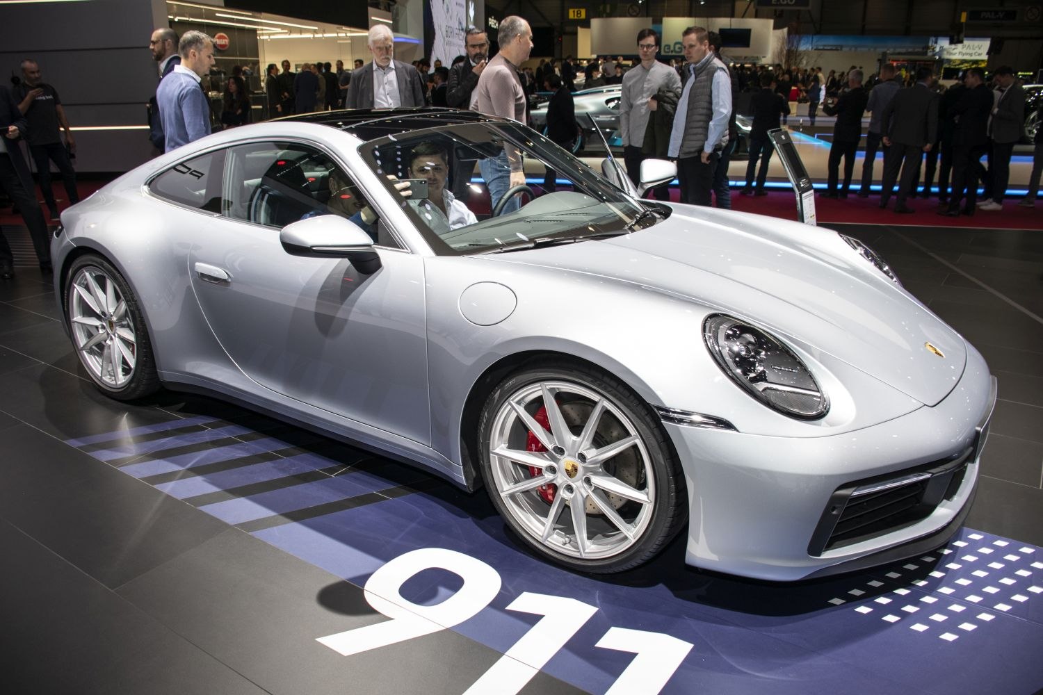 Silver sports coupe with alloy wheels and LED headlights