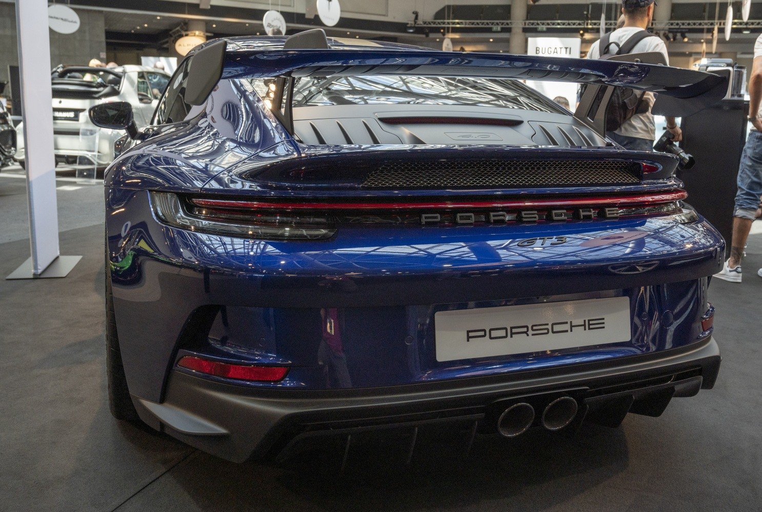 Rear view with prominent rear wing and dual exhausts
