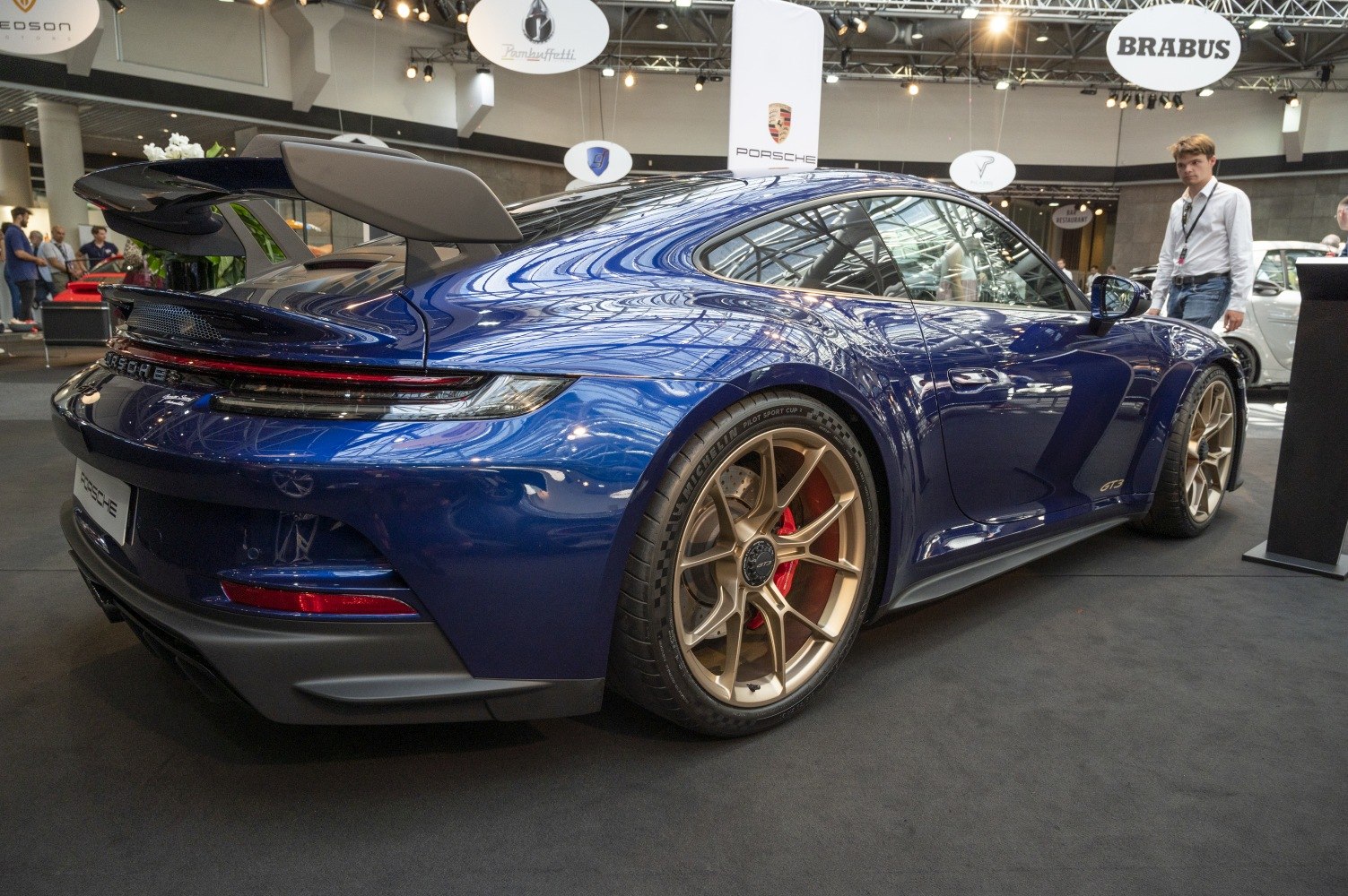 Rear side view, large rear wing, gold alloy wheels