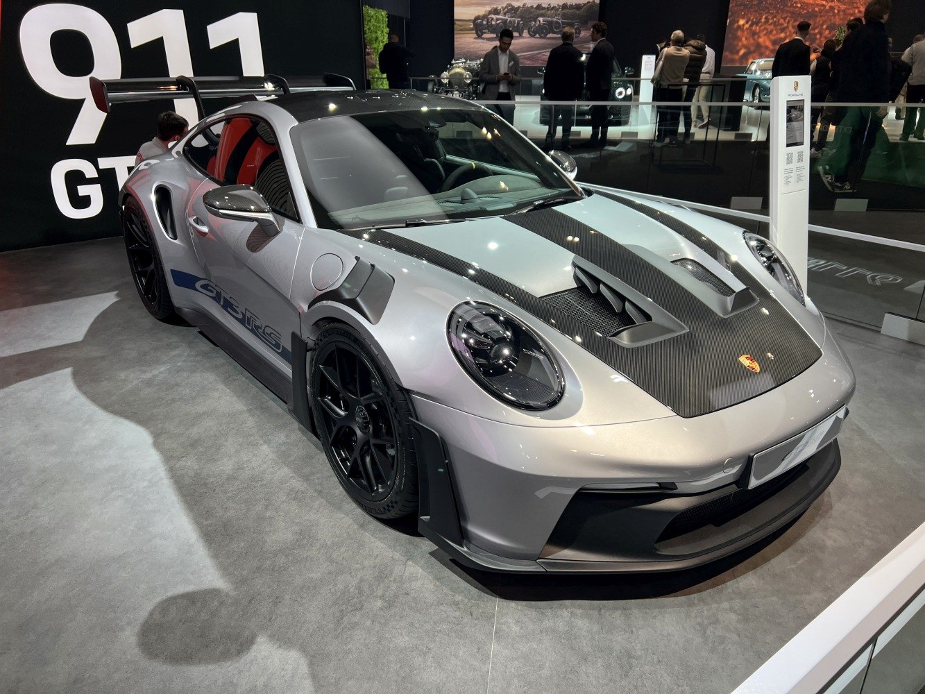 Carbon fiber hood and large rear wing aerodynamic features