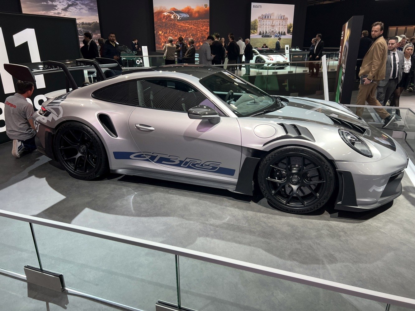 Sports coupe with aerodynamic vents, large rear wing, and matte black wheels