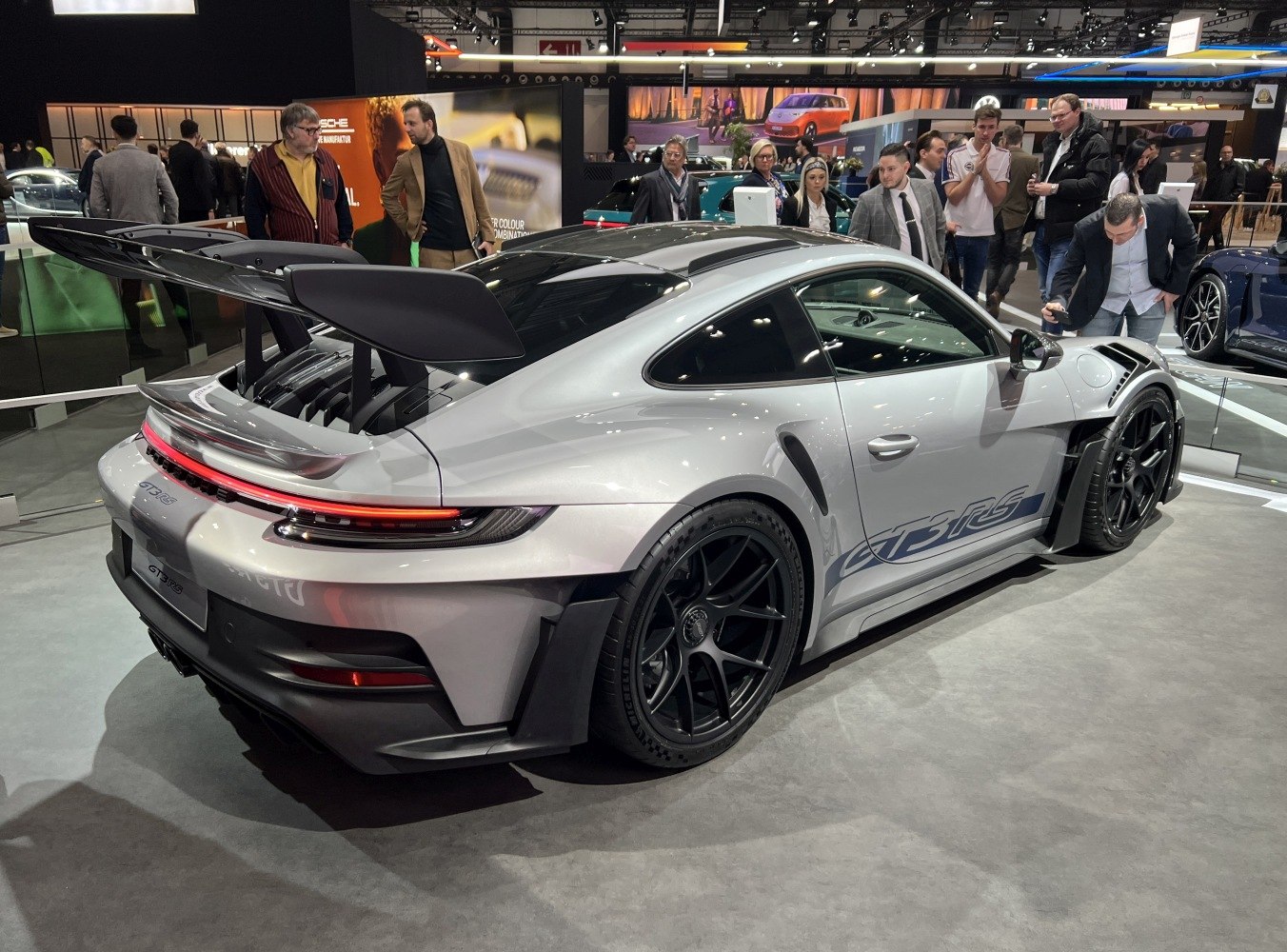Sports coupe with large rear wing and black multi-spoke wheels