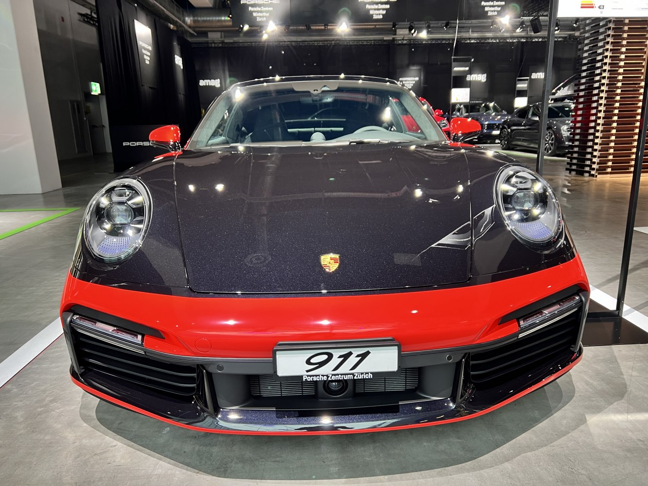 Front view with LED headlights and red-black dual-tone bumper design