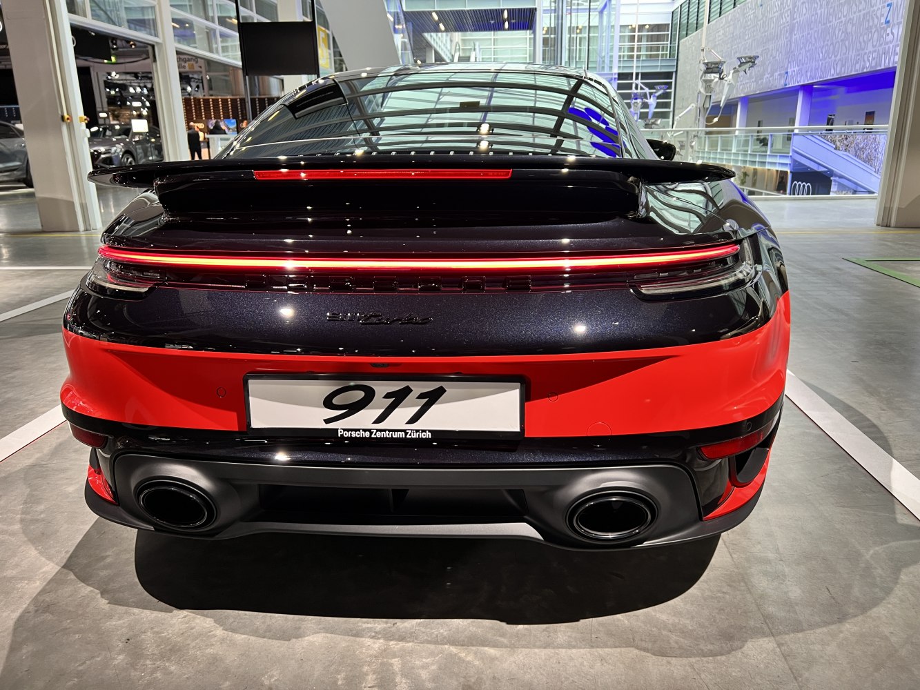 Rear with wide LED light bar and dual round exhaust pipes