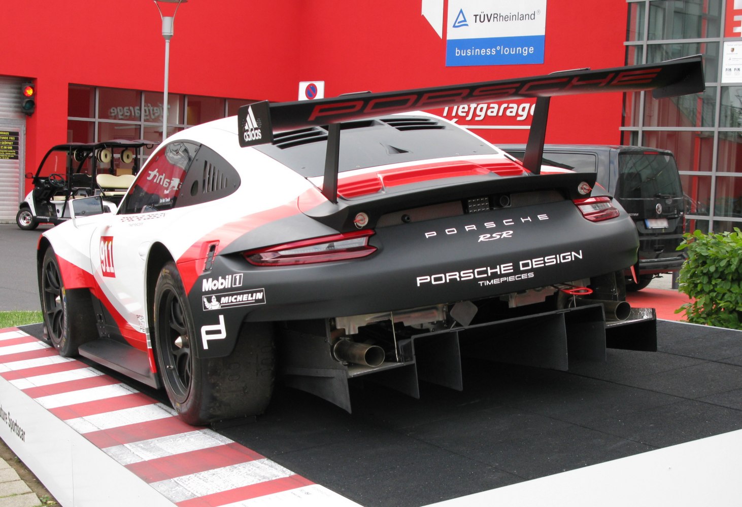 Racing car rear with large wing and aerodynamic diffuser
