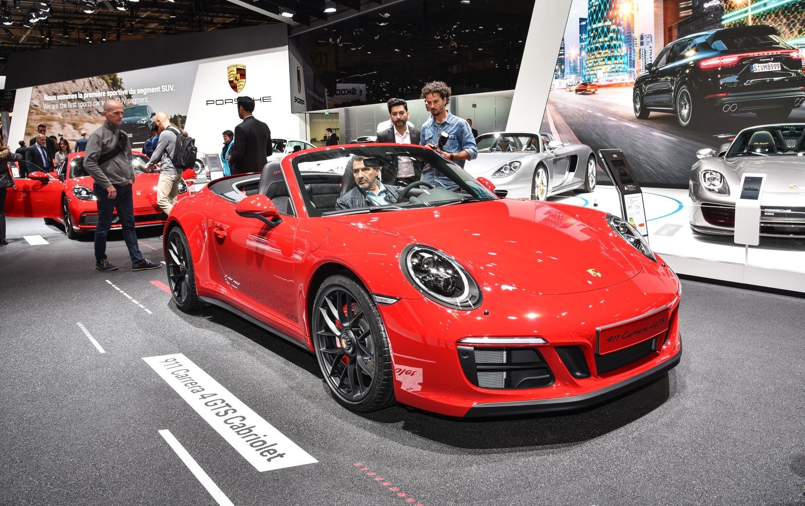 Red convertible 911 with black wheels and sporty front end