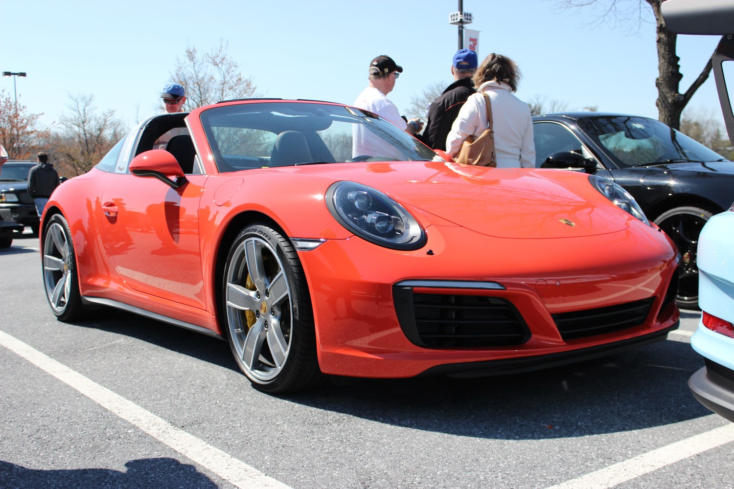 Red sports car with Targa roof and alloy wheels