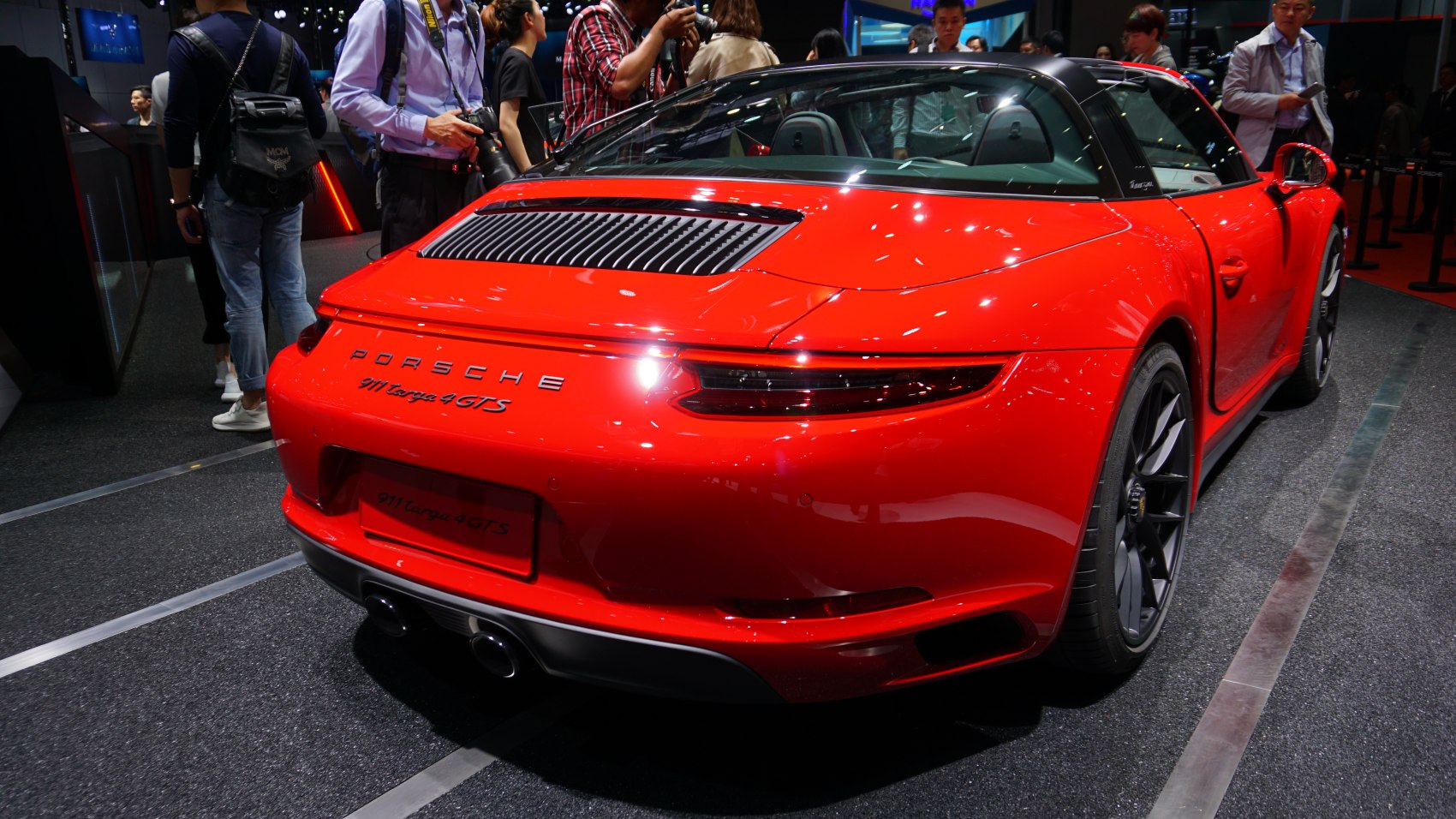 Red Porsche 911 Targa 4 GTS rear with distinctive taillights and Targa roof
