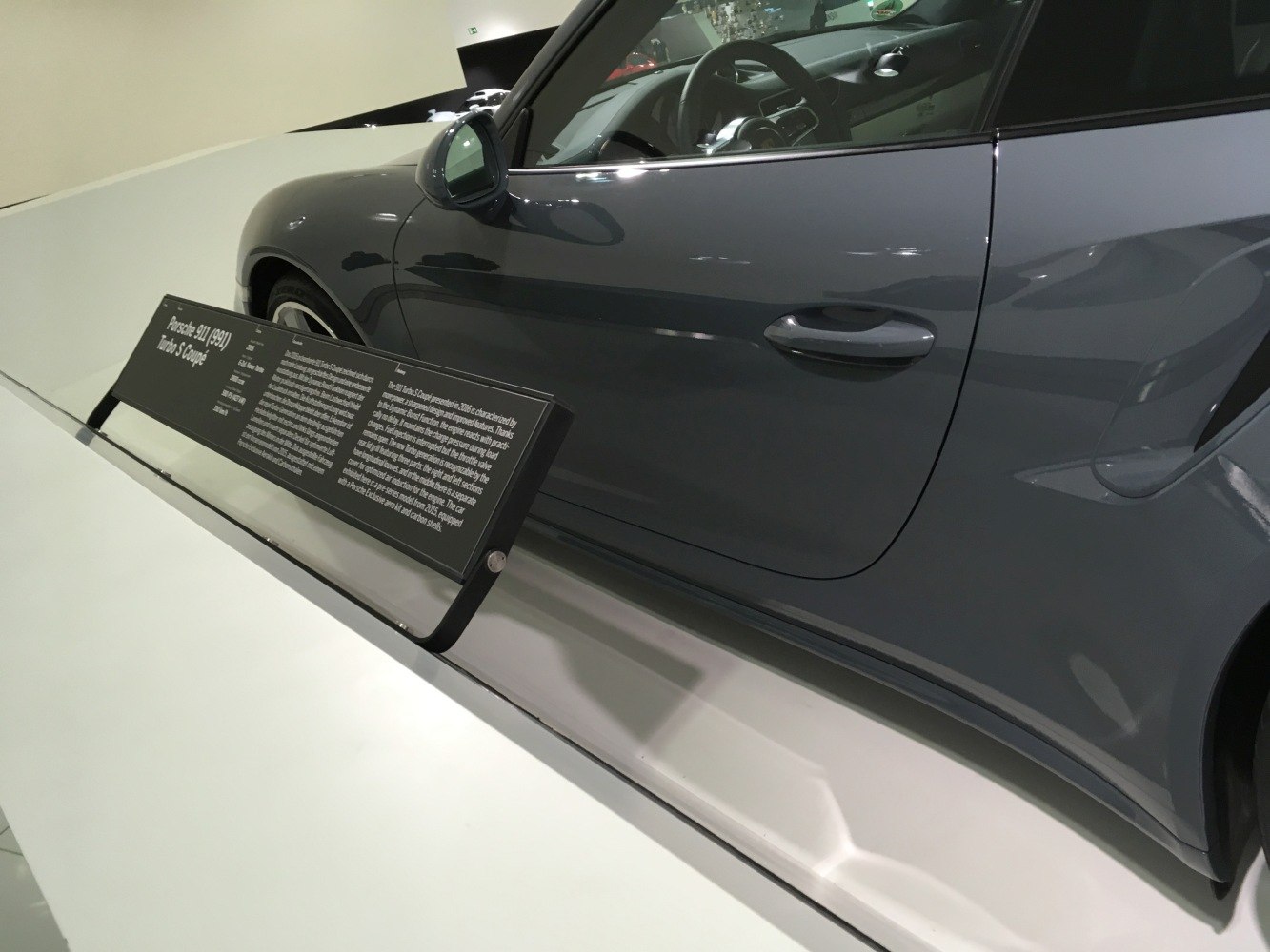 Side profile and interior view of a sports coupe