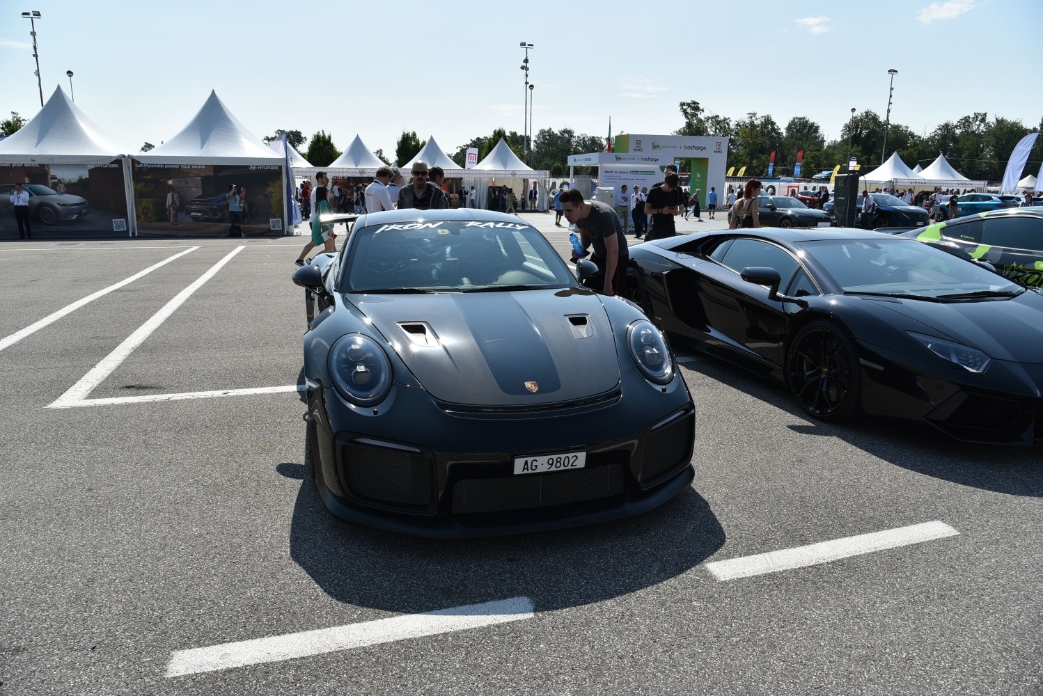 Front view of a Porsche 911 with carbon fiber hood and round headlights