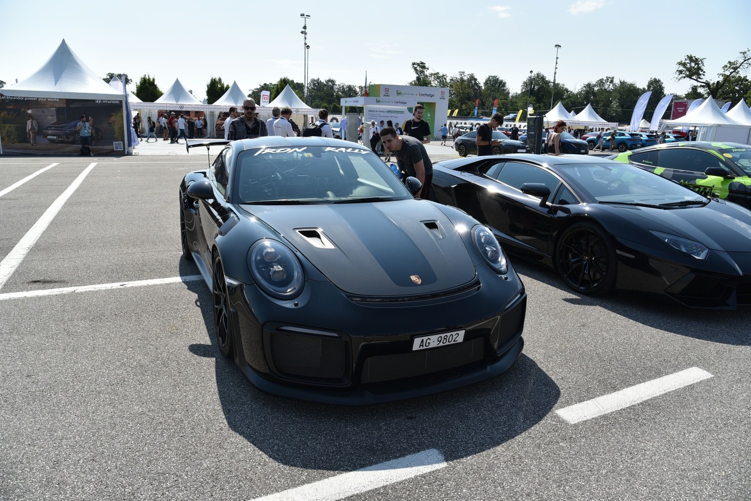Carbon fiber hood and wide body kit on a sleek sports coupe