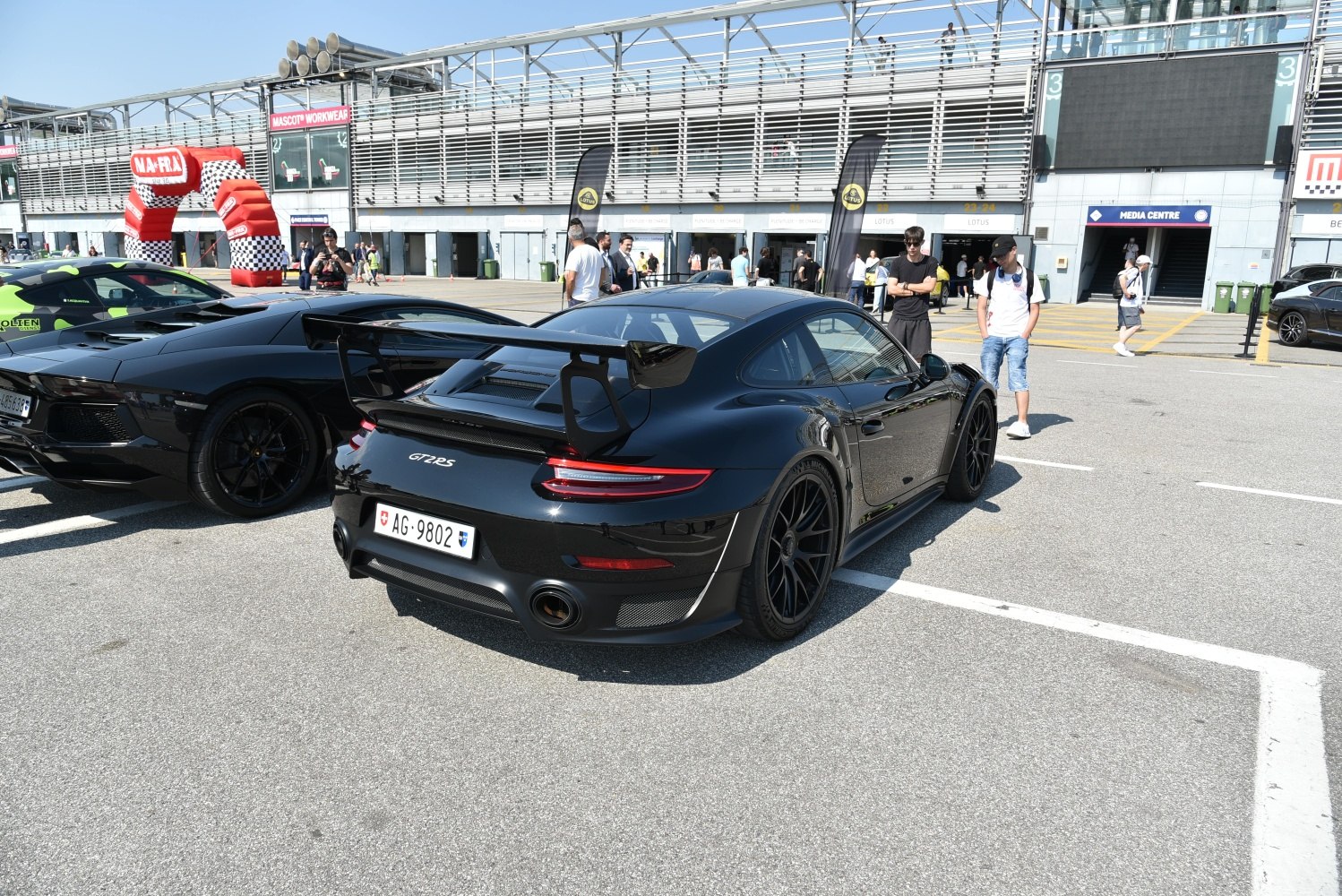 Black Porsche 911 GT2 RS rear with large aero wing and sporty black wheels