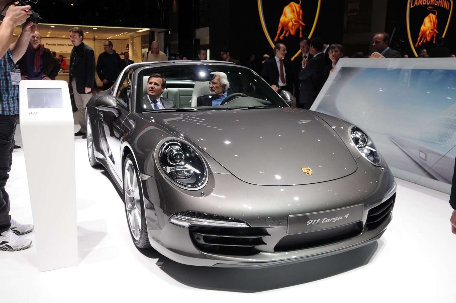 Front view and interior seating of a gray sports coupe with Targa roof