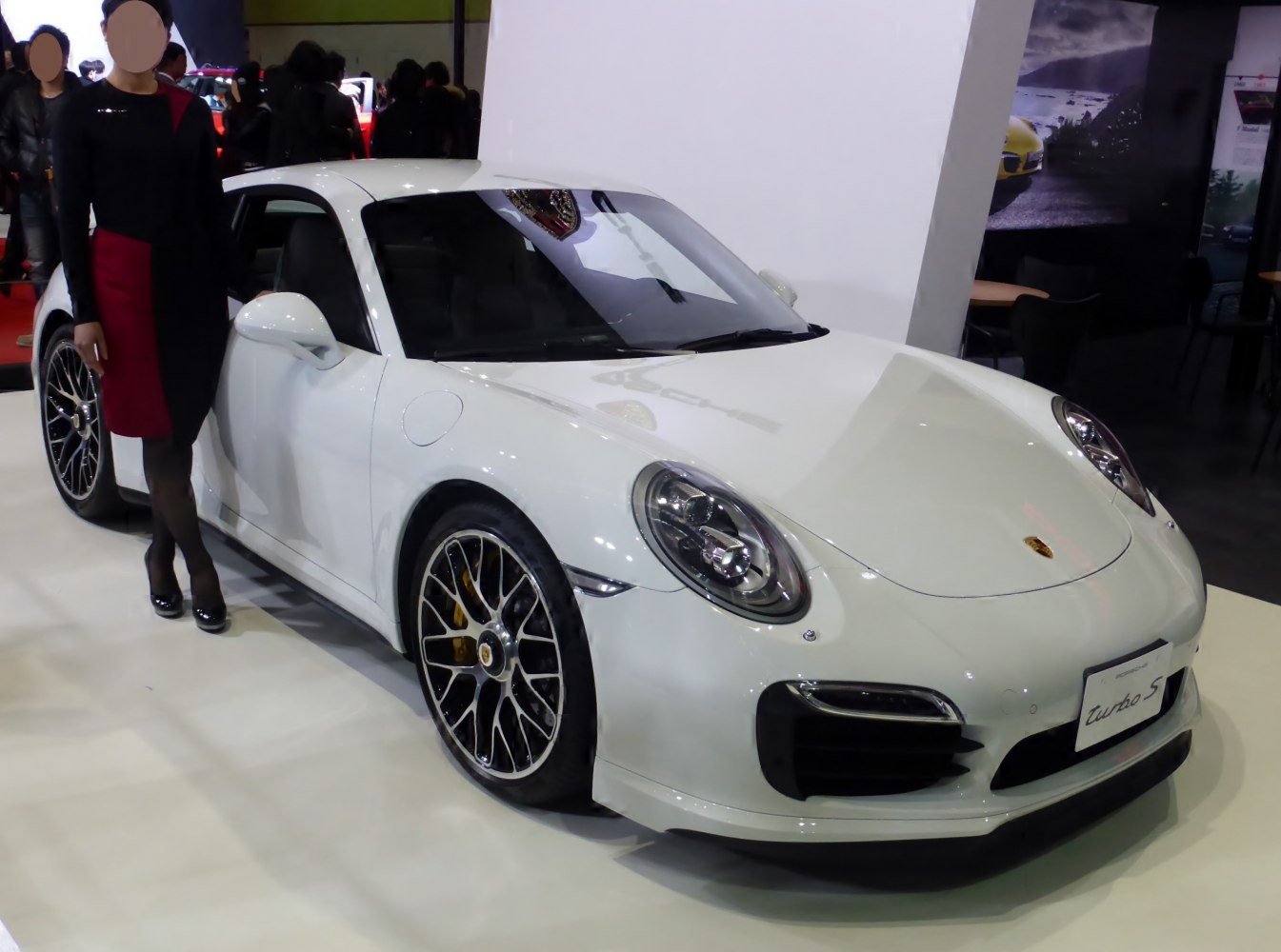 White Porsche 911 991 Turbo S with unique multi-spoke wheels and LED headlights