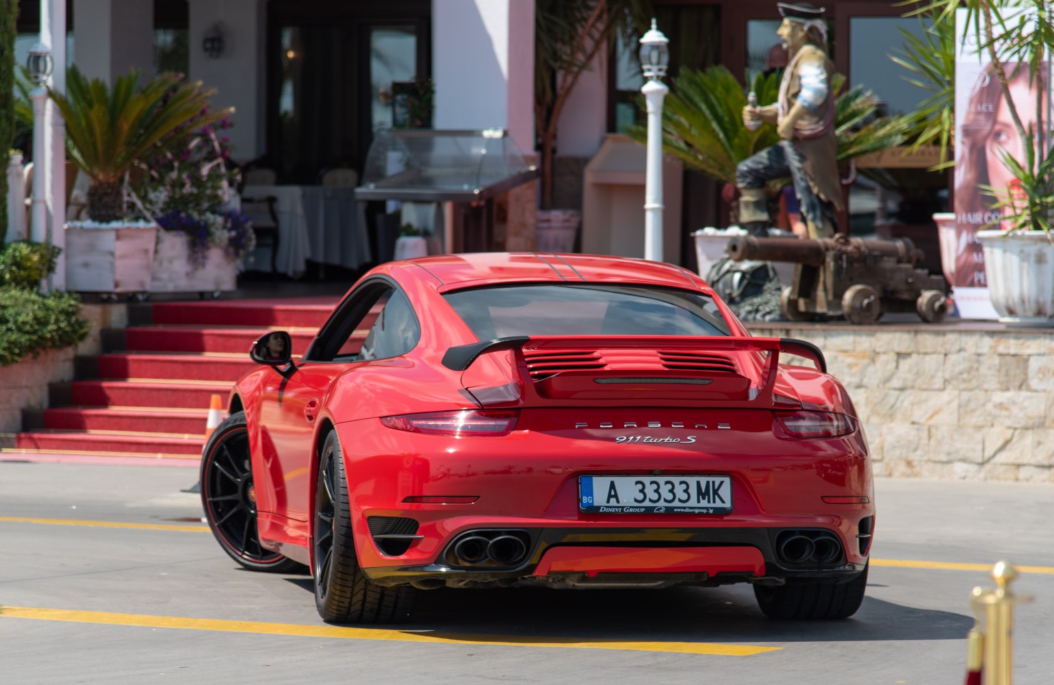 Rear view with spoiler and quad exhaust pipes