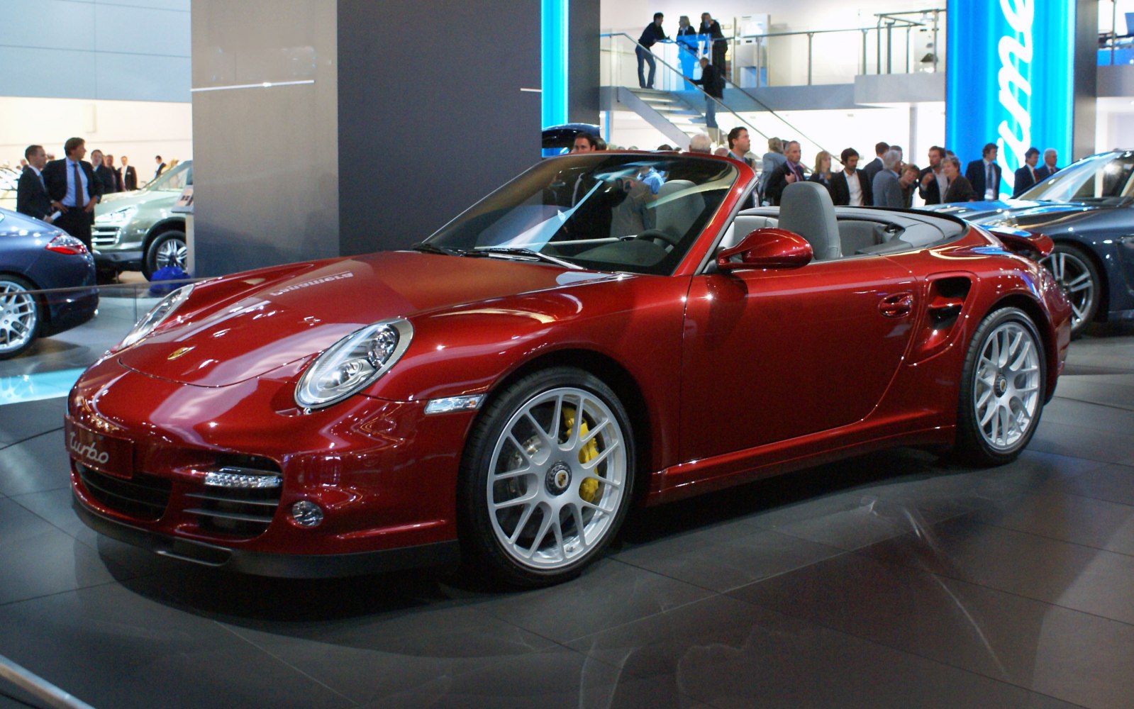 Red turbo convertible with distinctive front and side design.