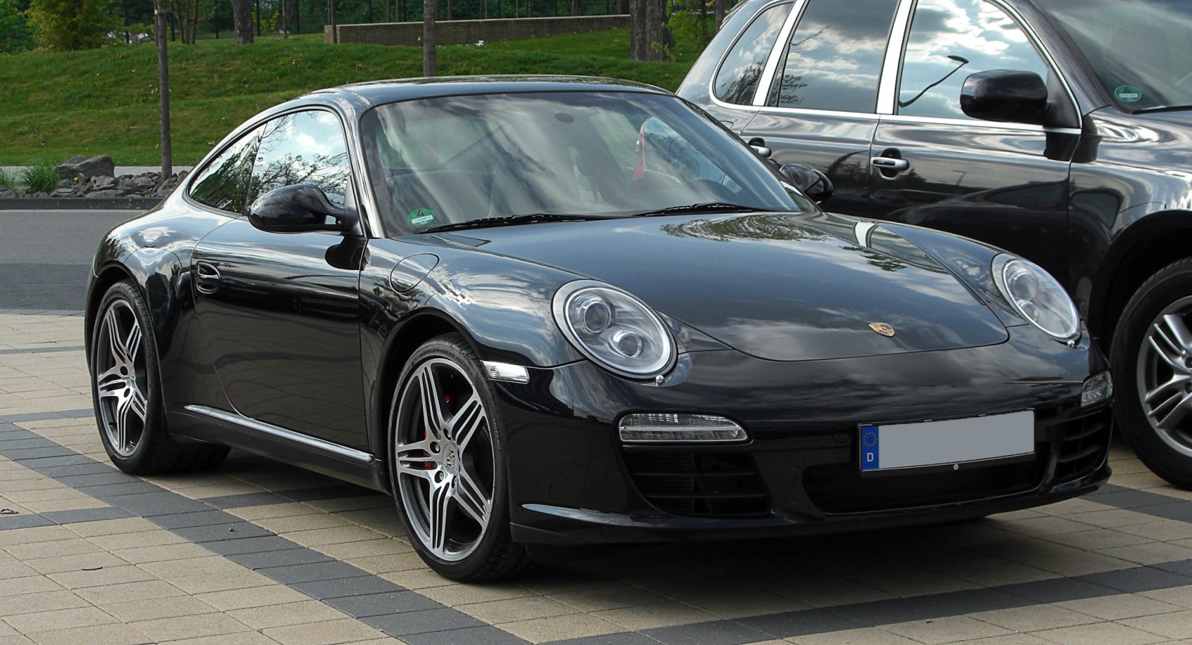 Sleek front side view with rounded headlights and alloy wheels