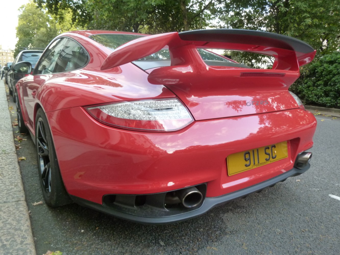 Close-up rear view showing large spoiler and tail lights