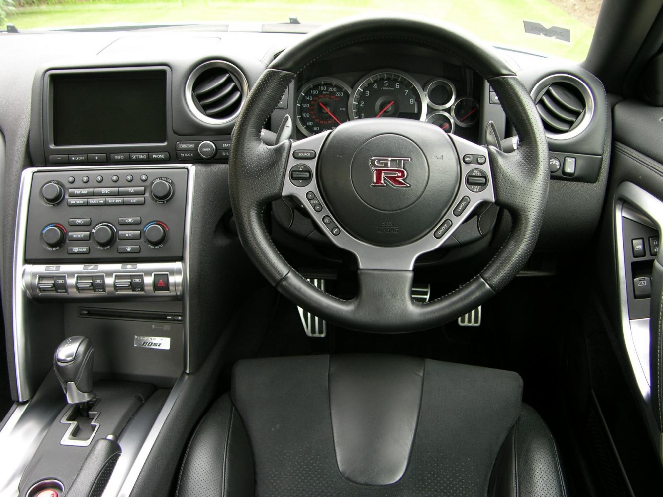 Steering wheel, dashboard gauges, and center console controls