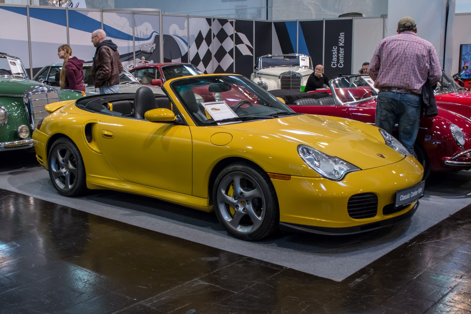 Yellow convertible sports car with alloy wheels and distinctive headlights