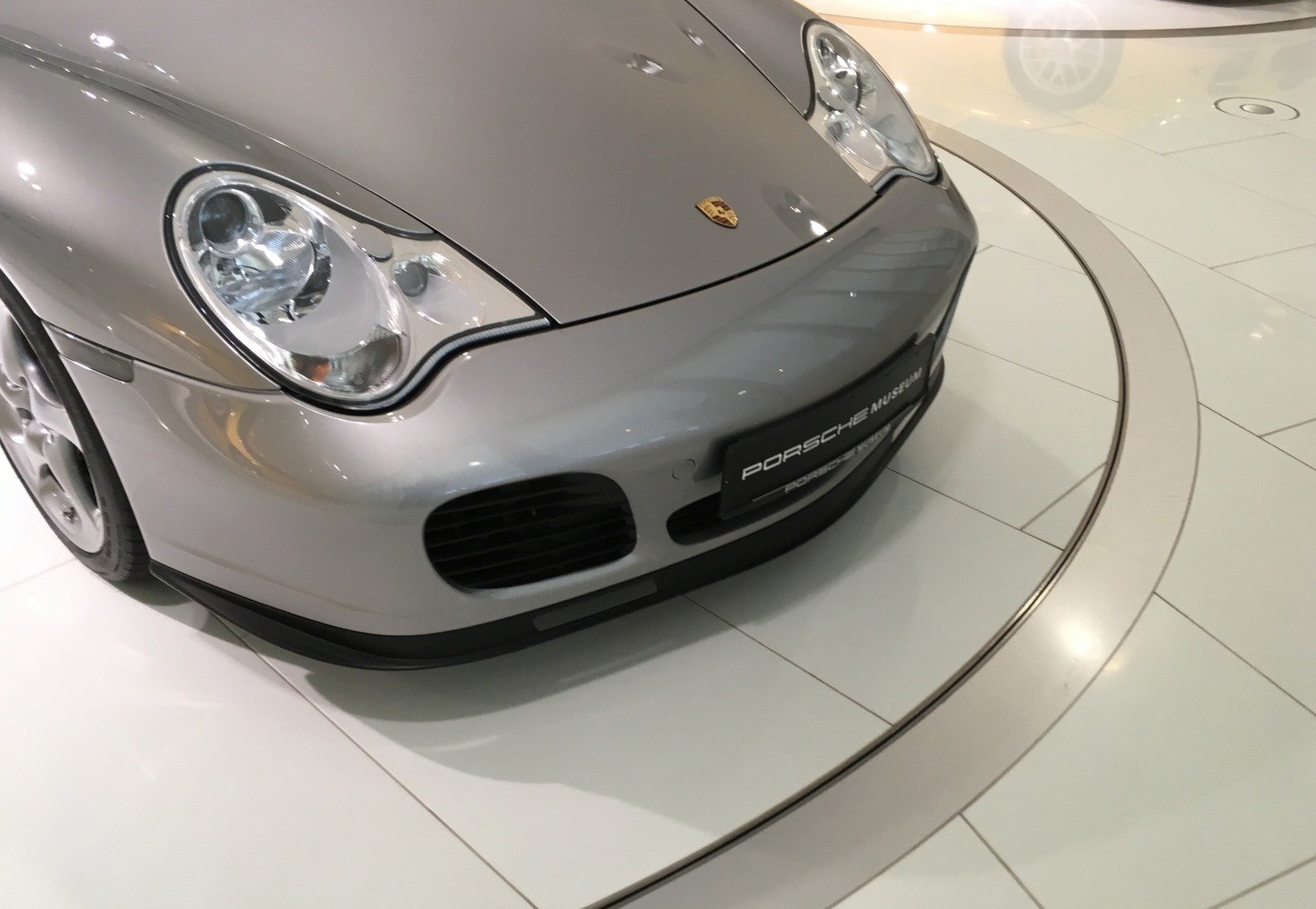 Front end and headlight design with Porsche emblem