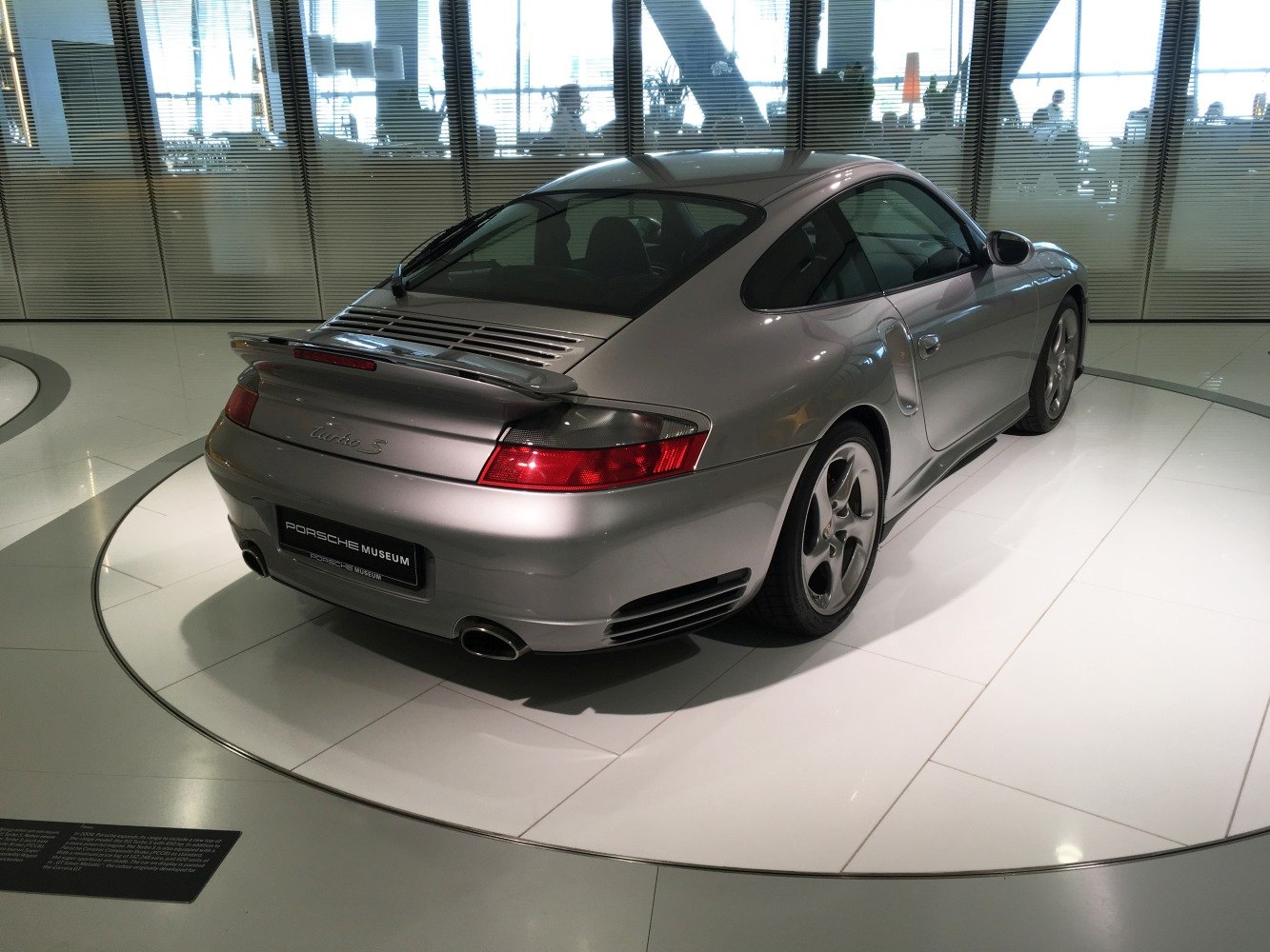 Rear and side view of a sports coupe with spoiler and distinctive taillights