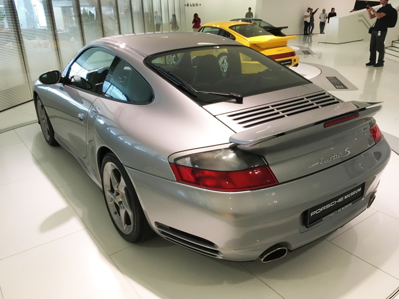 Silver rear view with spoiler and taillights
