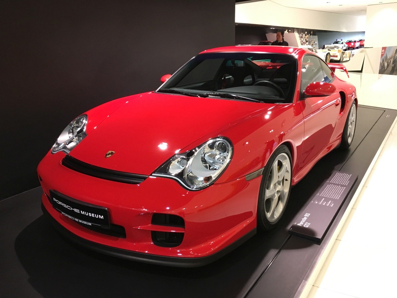 Red sports coupe with distinctive headlights and aerodynamic front design