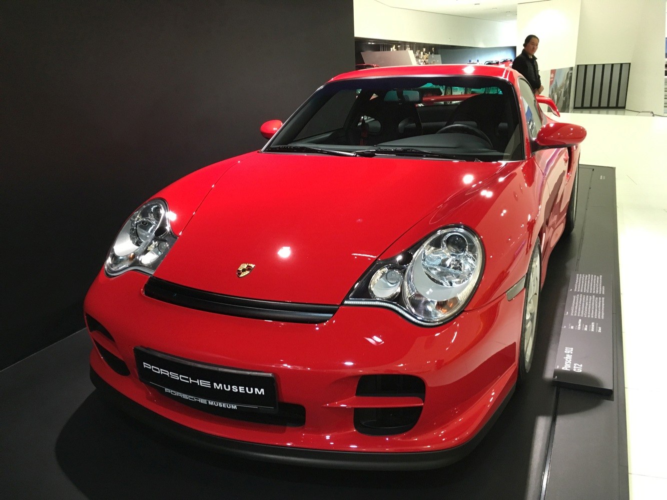 Red sports car front with distinctive headlights and sleek design