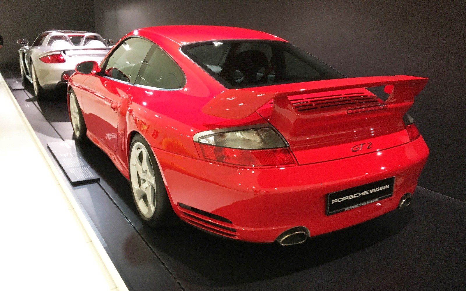 Red 911 with prominent rear wing and dual exhaust