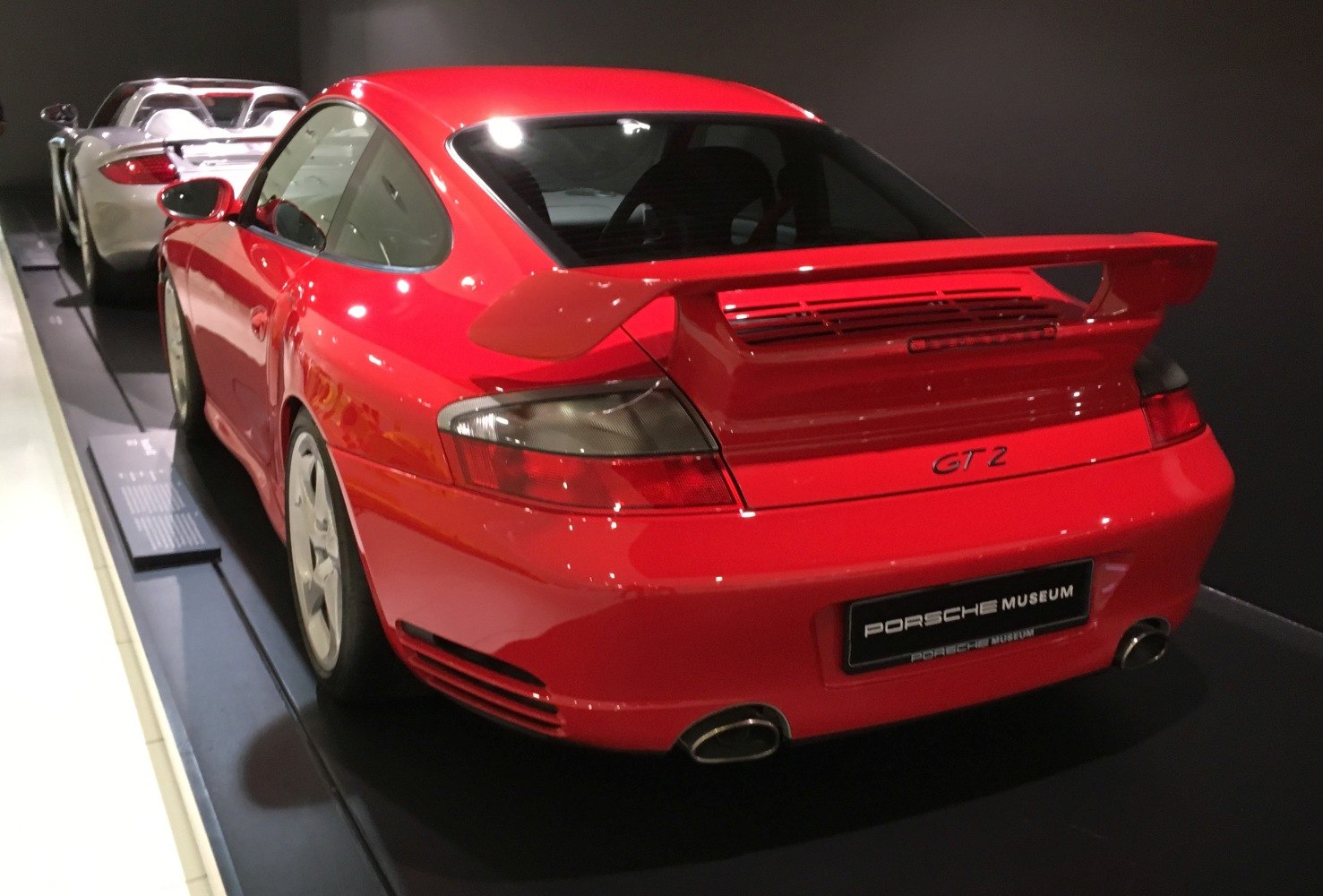 Red Porsche 911 996 GT2 rear with wide spoiler and dual exhausts