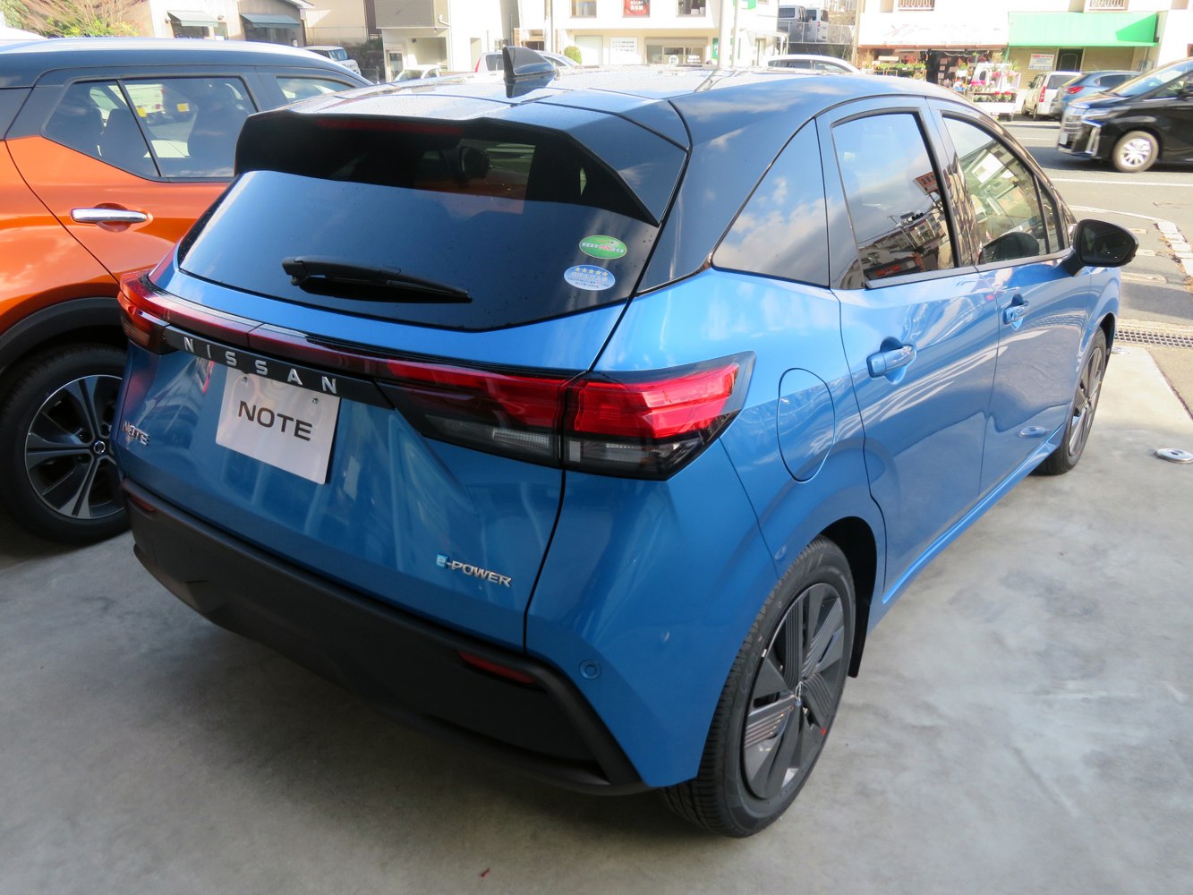 Rear and side view of a modern hatchback with sleek taillights