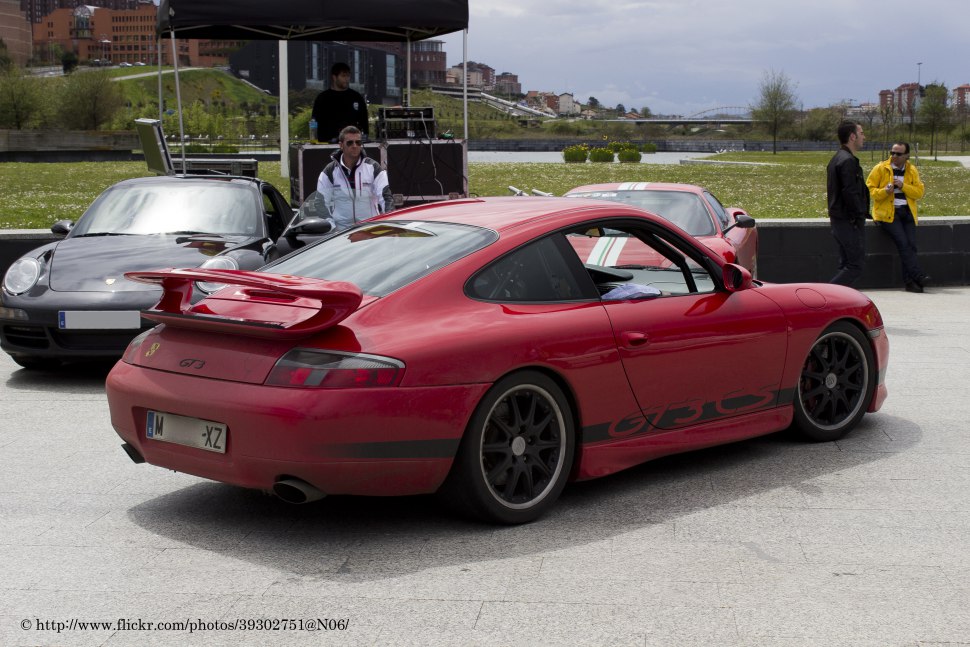 Red Porsche 911 996 GT3 with rear spoiler and black rims
