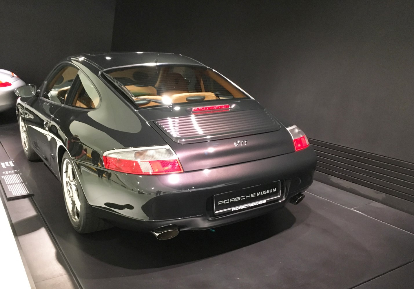 Rear view with distinctive tail lights and rear vent of a classic sports coupe