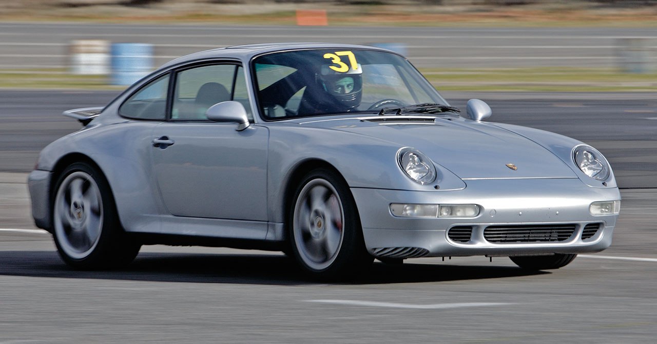 Silver sports coupe with aerodynamic design on race track