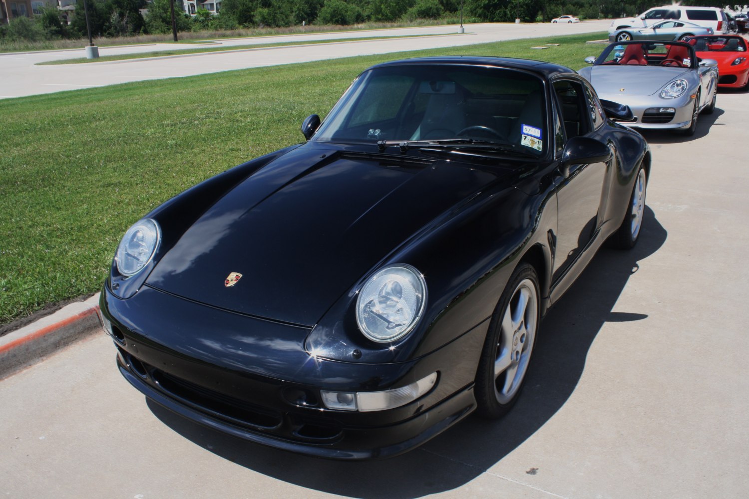 Classic 1990s sports coupe with round headlights and smooth hood