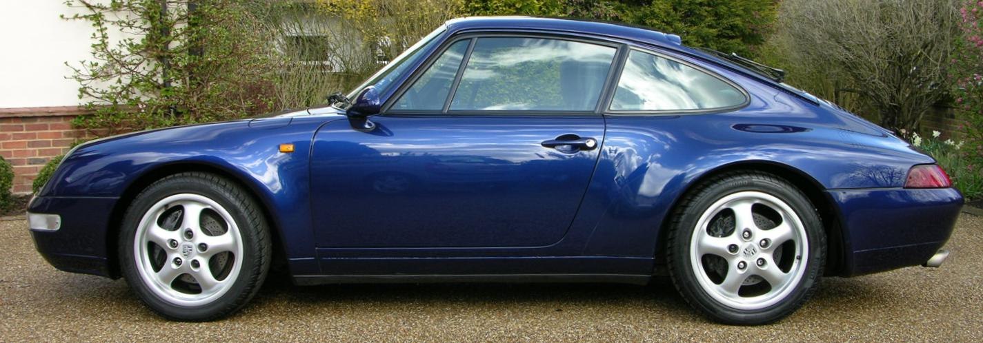 Classic smooth curves and alloy wheels side profile of a sports coupe