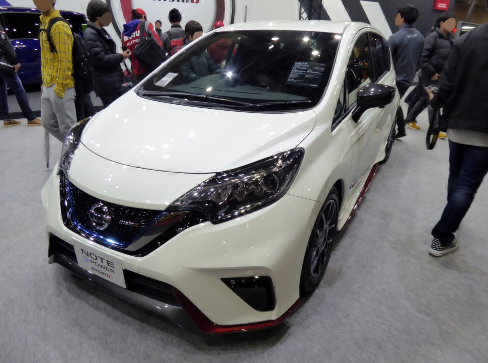 Sporty front view with distinctive headlights and grille