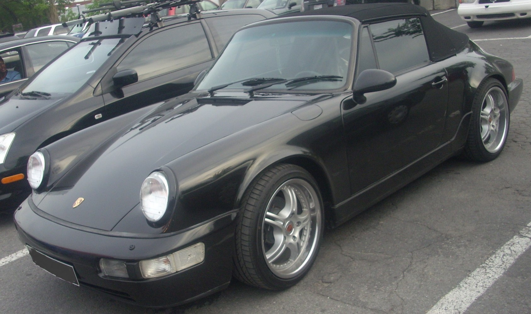 Soft top convertible with round headlights and alloy wheels