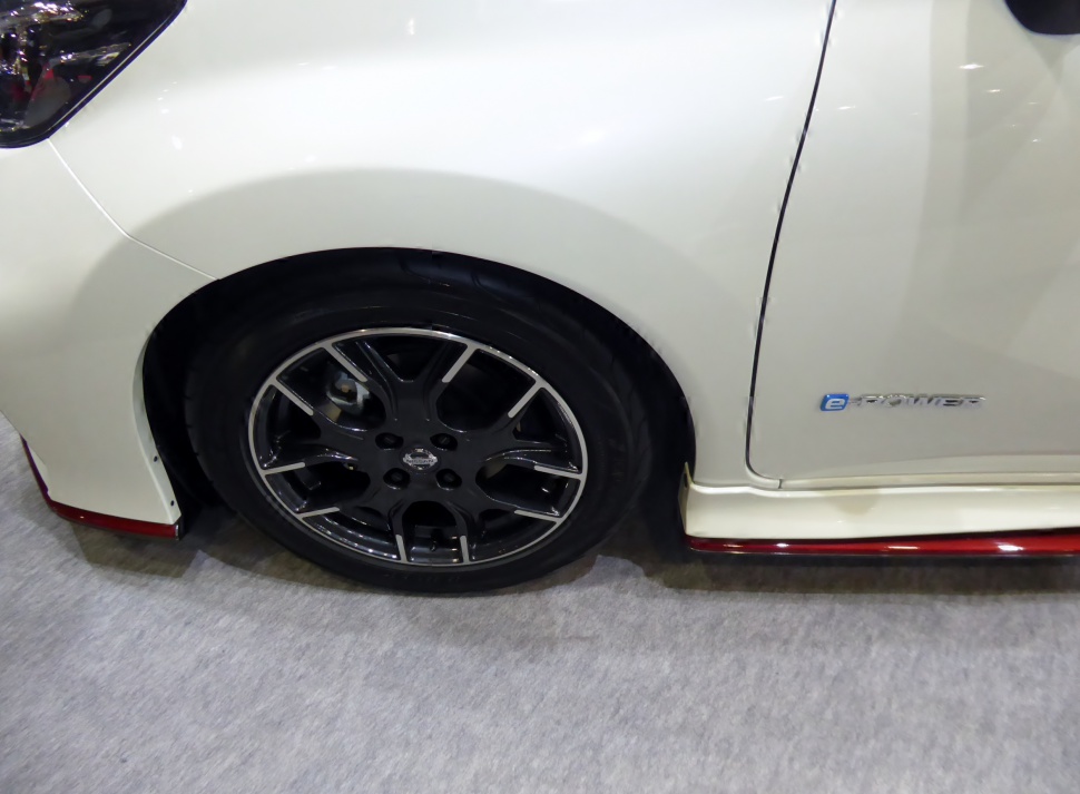 Black alloy wheel and e-Power badge on white car side
