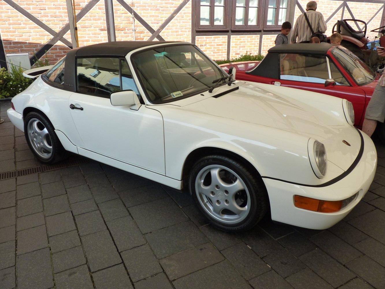 Classic 1990s sports coupe with unique Targa roof and five-spoke wheels.