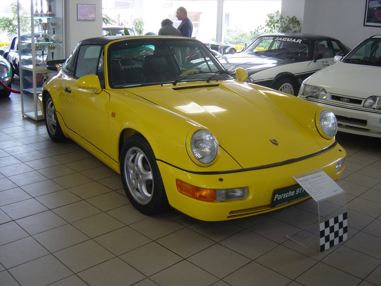 Yellow Targa convertible with round headlights and alloy wheels