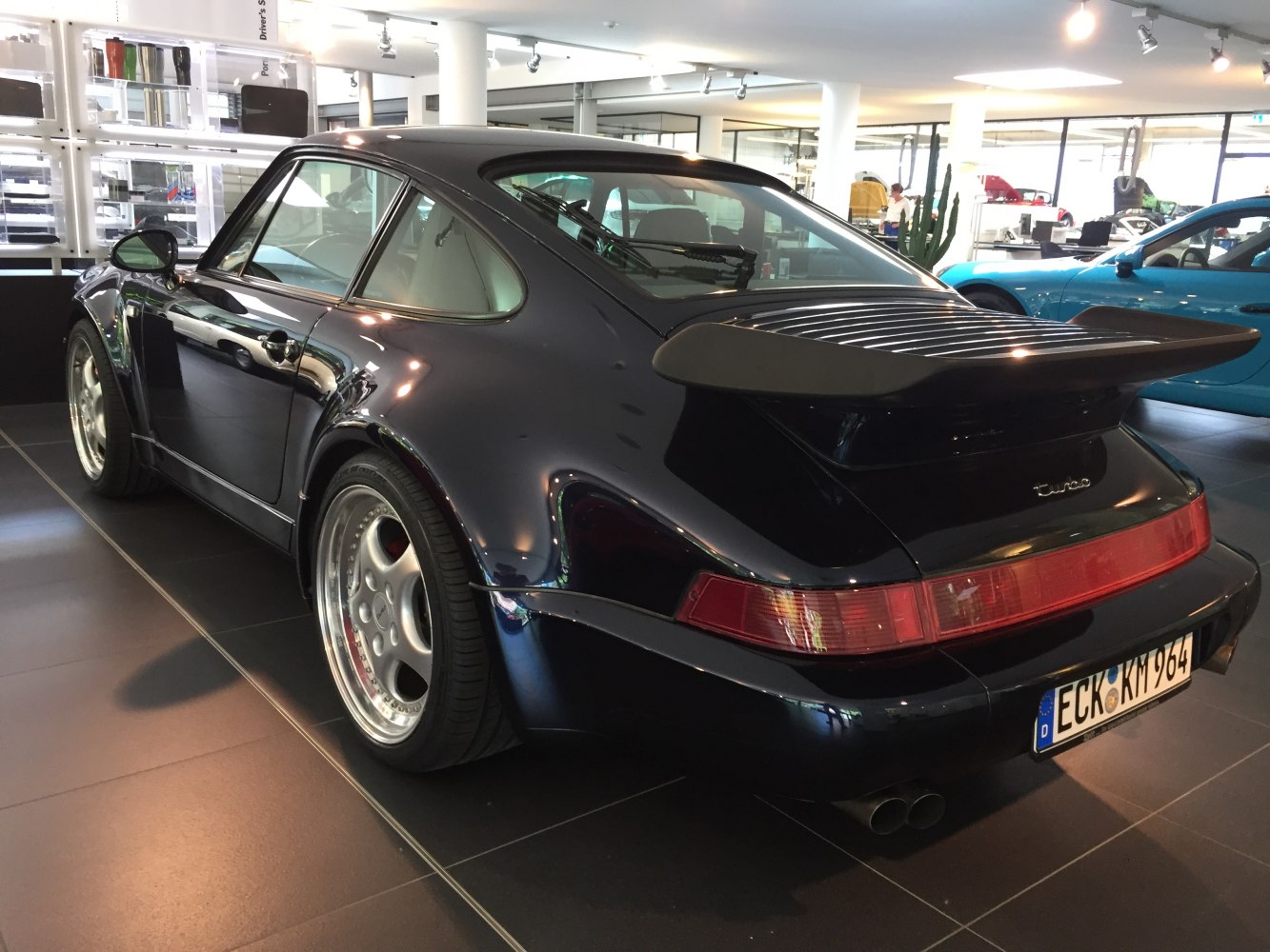 Rear and side view of a classic turbo sports coupe with wide fenders and iconic spoiler