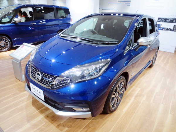 Front view of compact hatchback with alloy wheels and sharp headlights