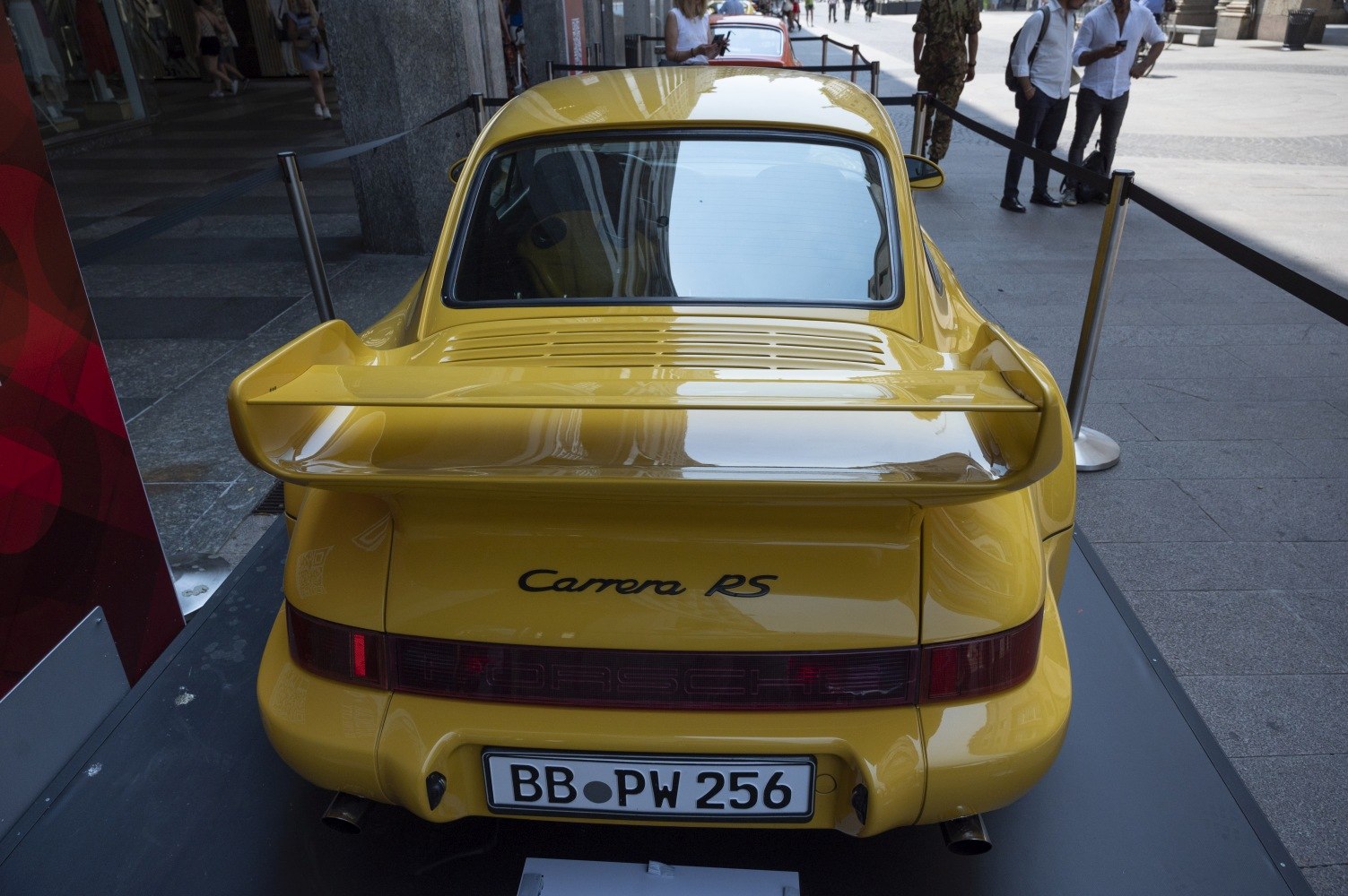 Rear of yellow Porsche 911 (964) Carrera RS with wide spoiler and tail lights