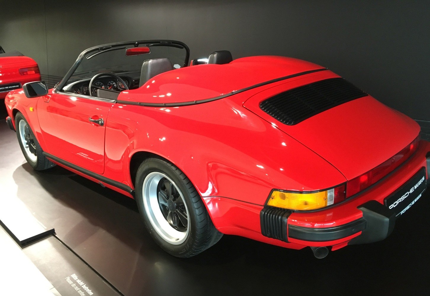Convertible with distinctive rear cover and vintage wheels